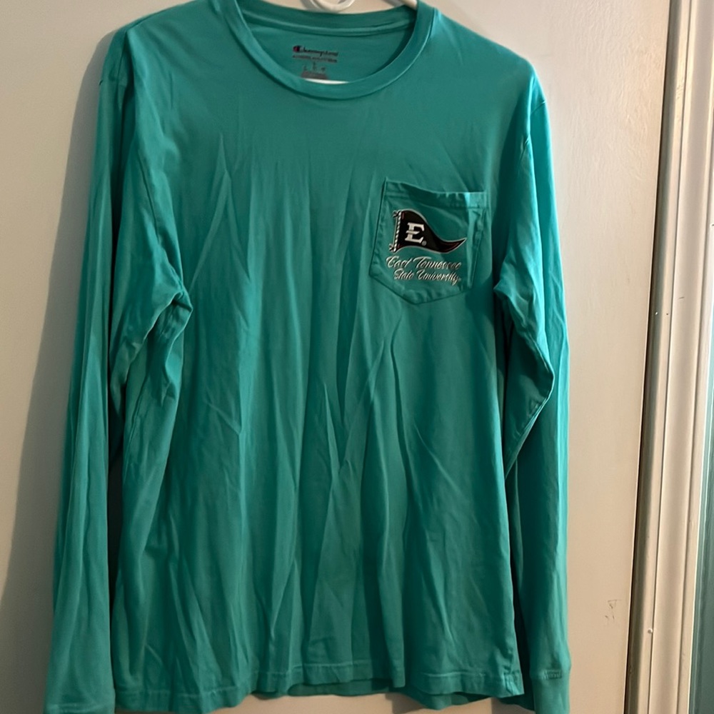 Blue long sleeve Champion shirt.